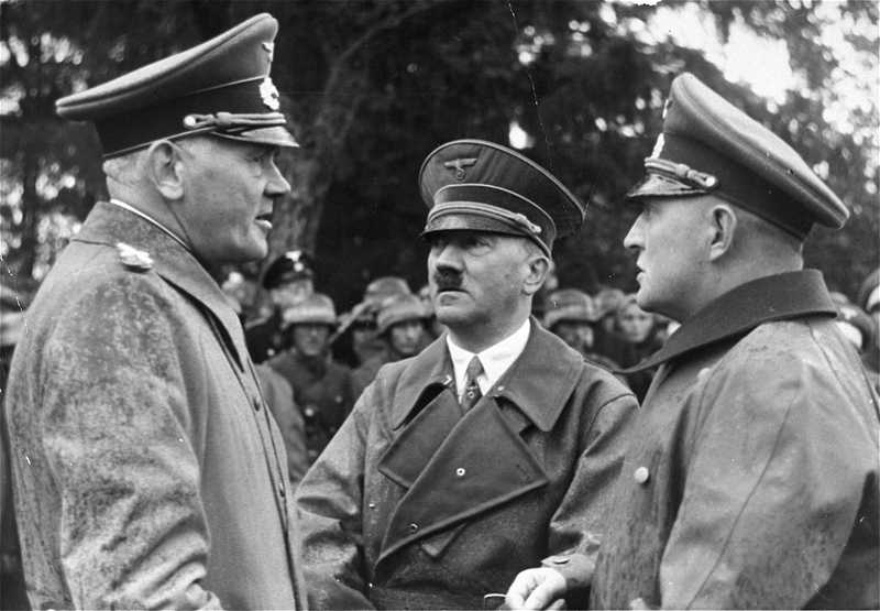 Adolf Hitler with Field Marshall Werner von Blomberg and his Adjutant Colonel Hossbach, speaking about maneuvers of the Wehrmacht in Neustrelitz, Mecklenburg
